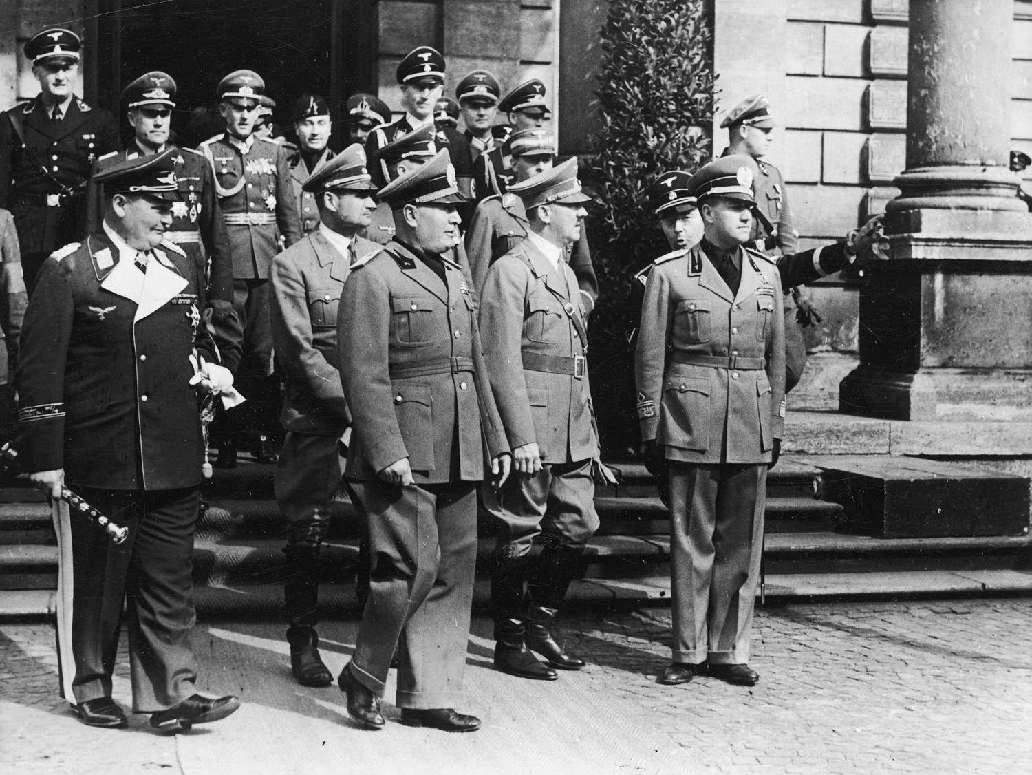 Adolf Hitler leaves Munich's station with Mussolini, Ciano and his staff before the Munich conference